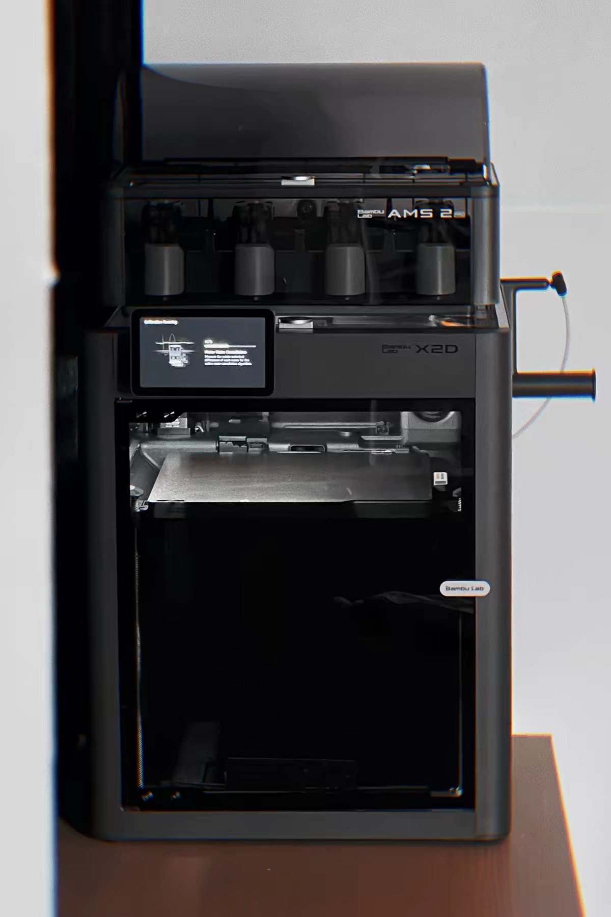 Bambu Lab X2D vs Creality K2 Pro: Which One Should You Buy? (2026) 4 Bambu Lab X2D with AMS 2 Pro side view showing touchscreen display