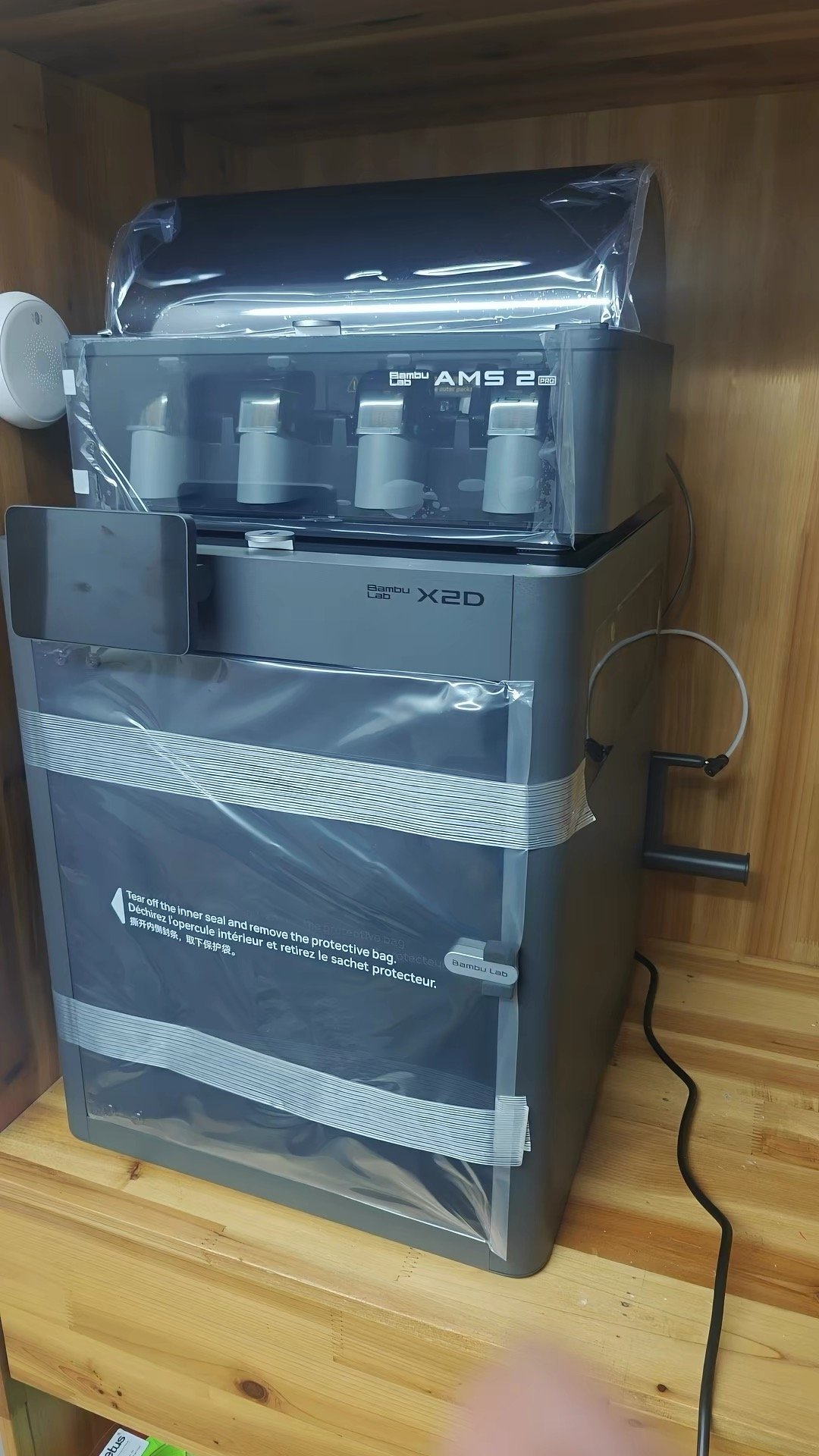 Bambu Lab X2D vs Creality K2 Pro: Which One Should You Buy? (2026) 11 Bambu Lab X2D and AMS 2 Pro still in protective packaging wrap