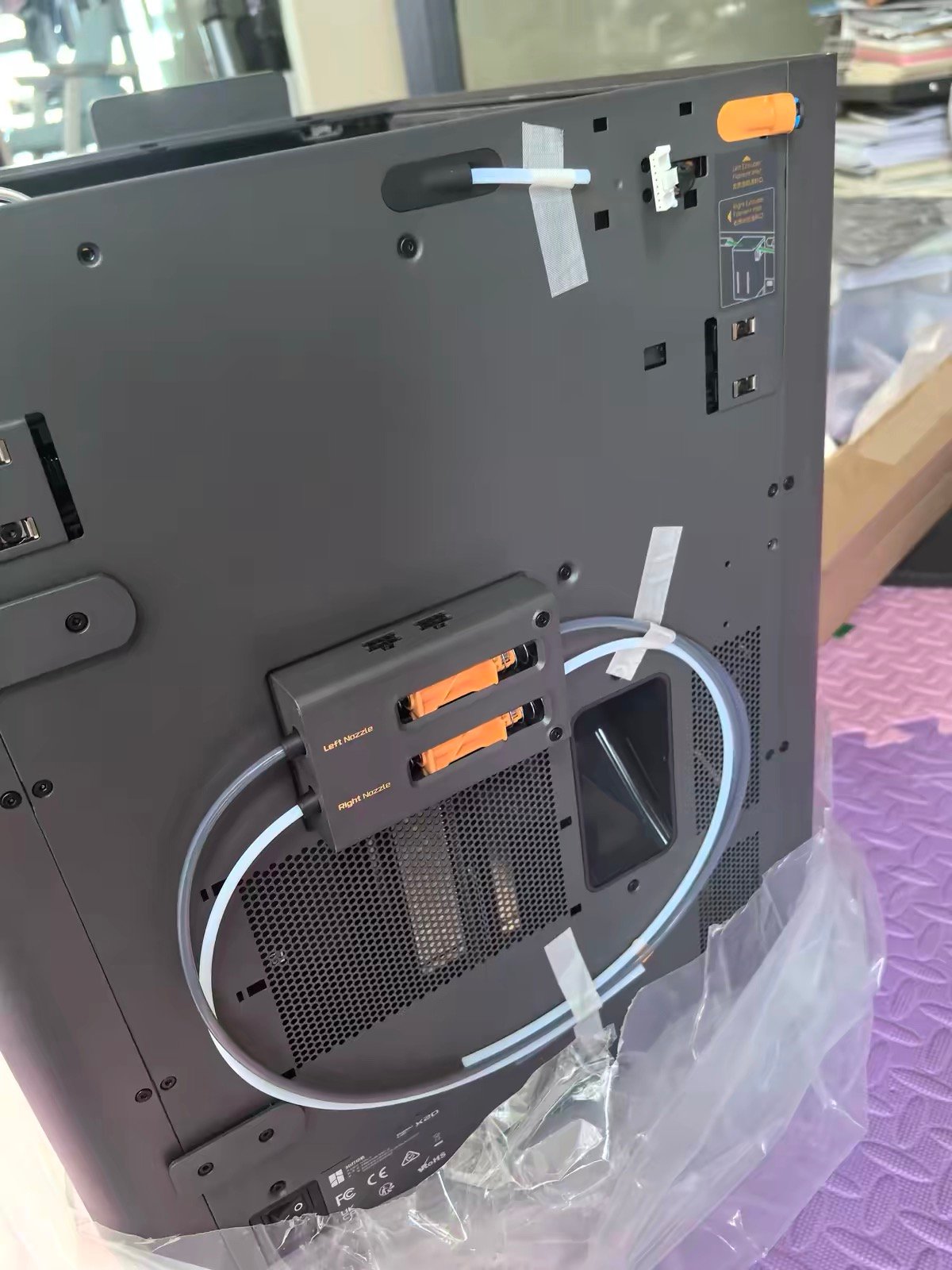 Bambu Lab X2D back panel showing Left Nozzle and Right Nozzle dual filament inputs