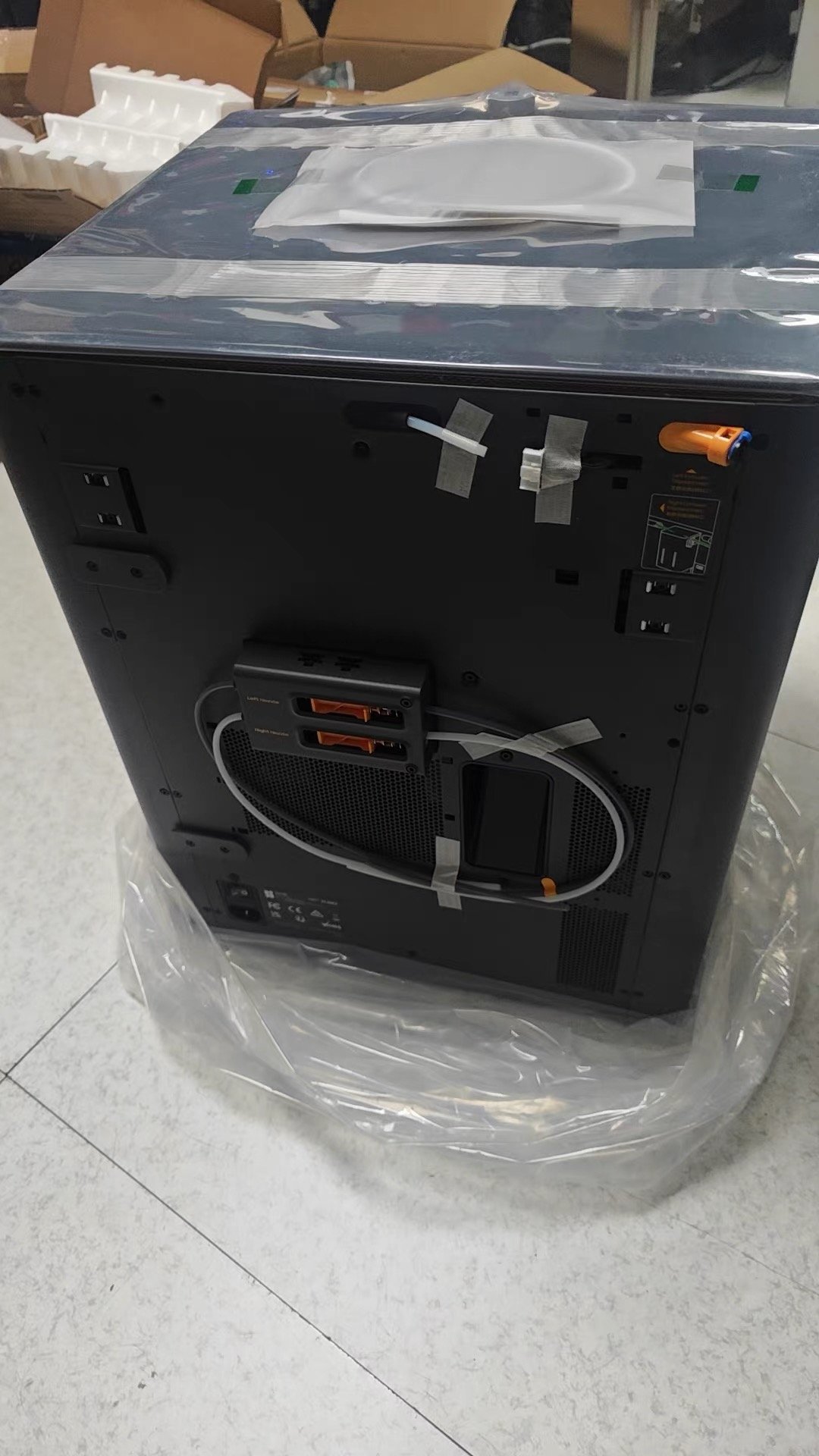 Bambu Lab X2D vs Creality K2 Pro: Which One Should You Buy? (2026) 5 Bambu Lab X2D back panel showing dual filament ports during unboxing
