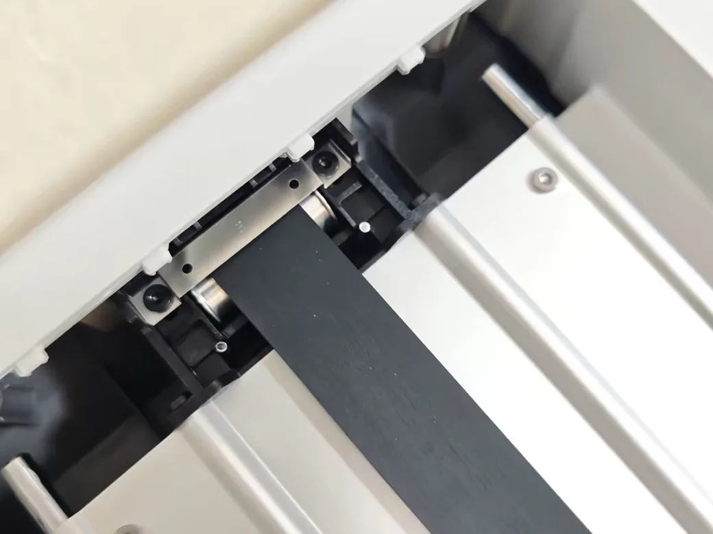 Bambu Lab A2L vs A1 (2026): Bigger, Smarter, and One Catch — Which Should You Buy? 7 Close-up of the Bambu Lab A2L linear rail and belt mechanism on the gantry