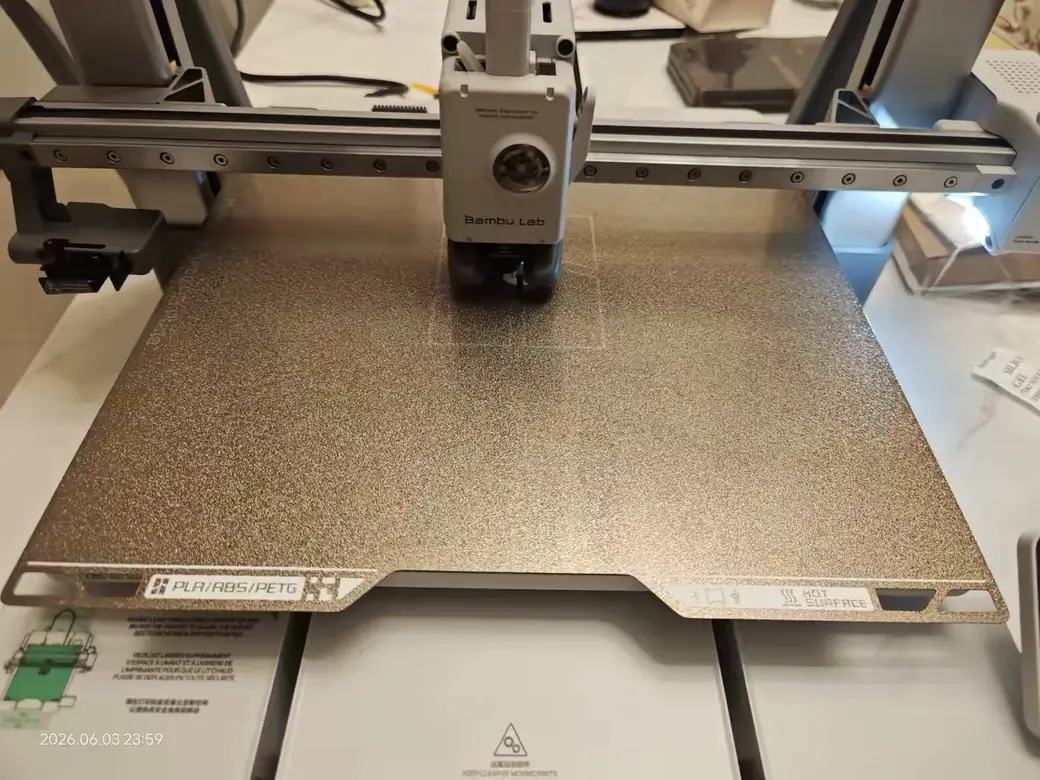 Best Bambu Lab 3D Printer for 2026: How to Pick the One That's Right for You 2 Front view of the Bambu Lab A2L print head over its gold textured build plate
