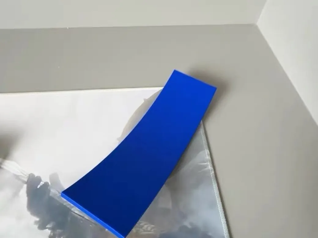 Blue scraper tool for removing 3D prints from the build plate