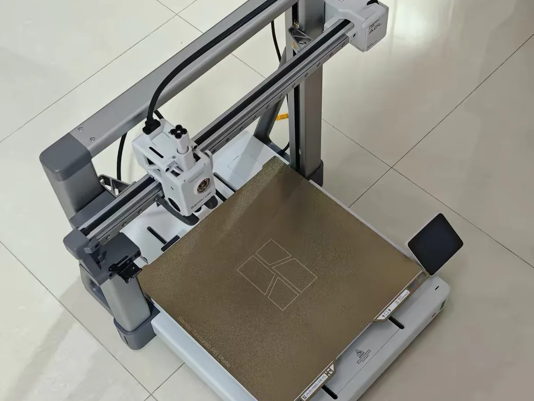 Open-frame Bambu Lab A2L 3D printer with no enclosure, seen from a 45-degree angle