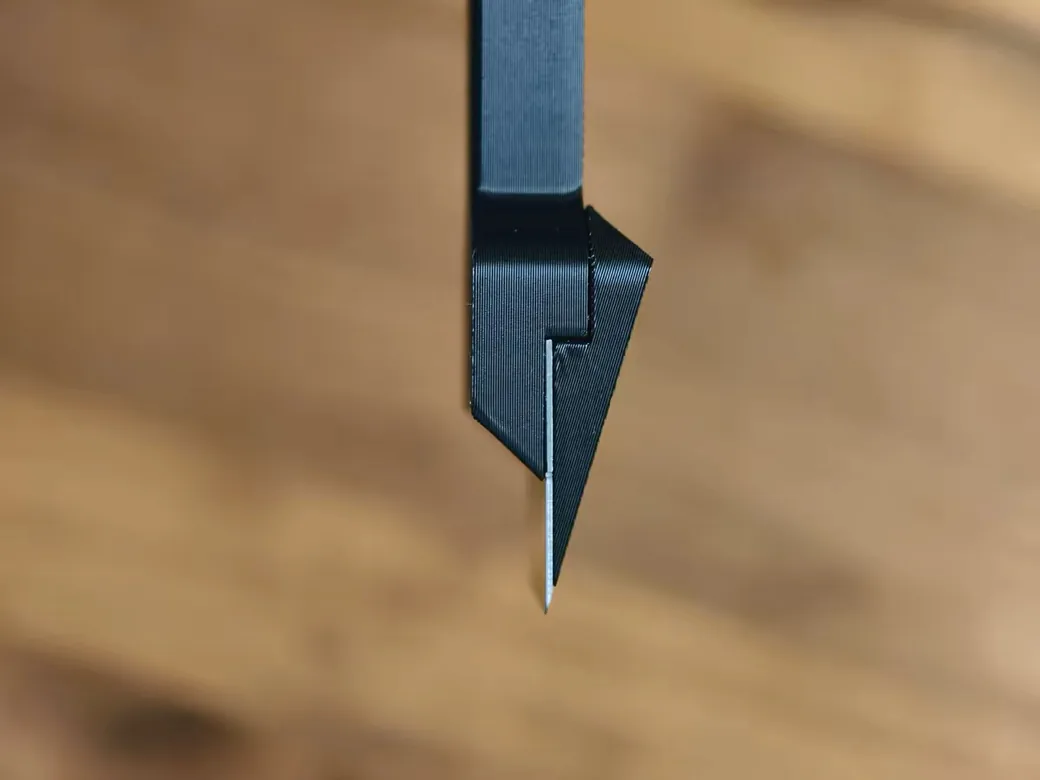 Close-up of a cleaning needle for 3D printer nozzle maintenance