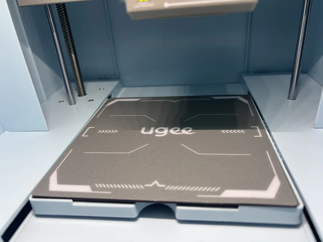 ugee Funbox 3D Printer Review: I Gave It to a 6-Year-Old for a Week 11 Magnetic flexible build plate sitting on the ugee Funbox print bed