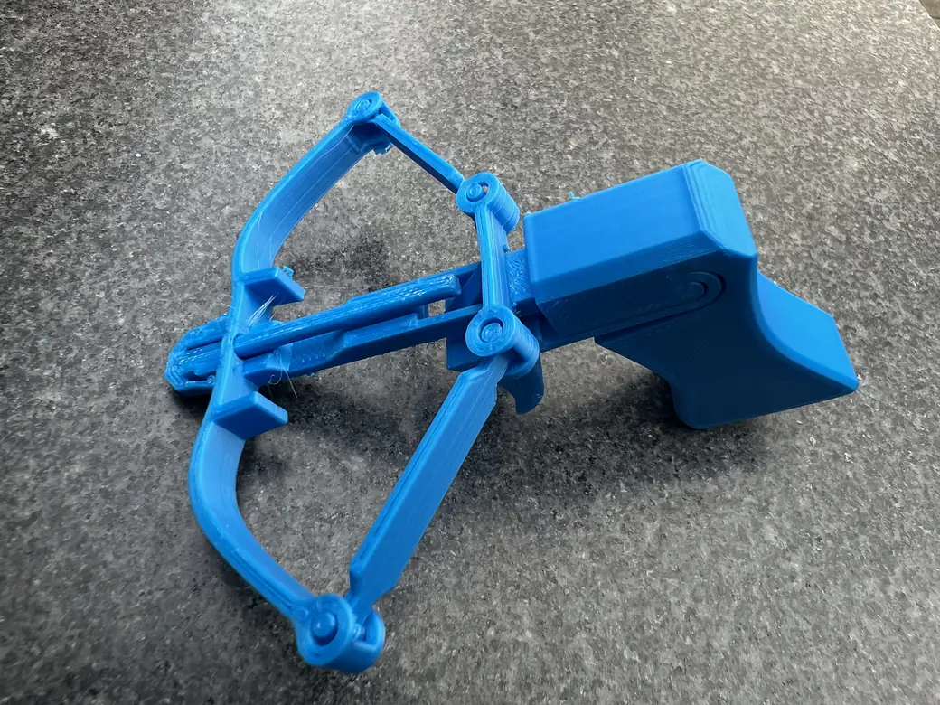 ugee Funbox 3D Printer Review: I Gave It to a 6-Year-Old for a Week 20 Blue 3D printed toy crossbow printed on the ugee Funbox