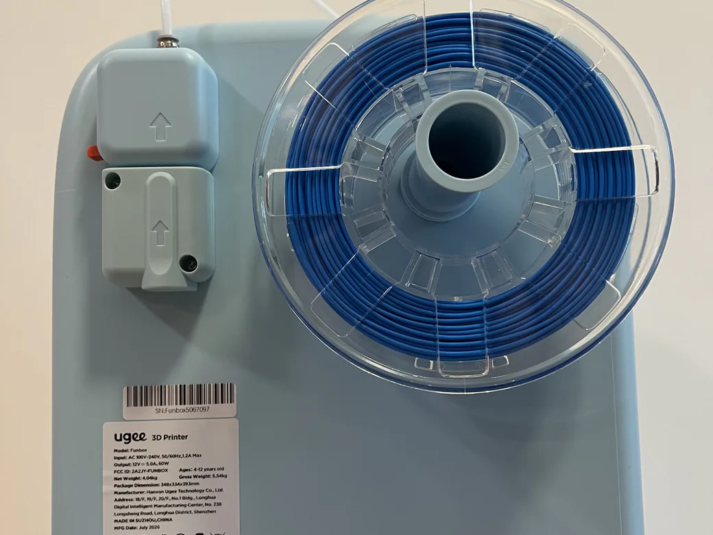 ugee Funbox 3D Printer Review: I Gave It to a 6-Year-Old for a Week 8 Rear of the ugee Funbox with a blue PLA spool mounted on the filament holder