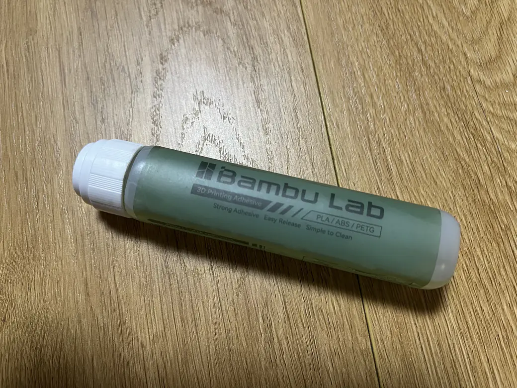 Food Safe 3D Printer Filament: What's Actually Certified, and What Still Isn't 3 Bambu Lab 3D Printing Adhesive glue stick lying on a wooden desk