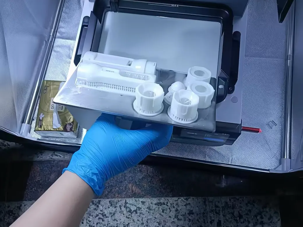Resin prints fresh off the build plate, before washing and curing