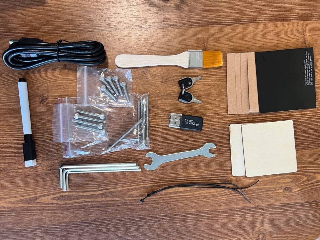 Carverall X1Pro Unboxing: Specs, Price, and What's in the Box (2026) 7 Carverall X1Pro tool kit laid out: hex wrenches, screws, zip ties, marker, focus test card, and USB card reader