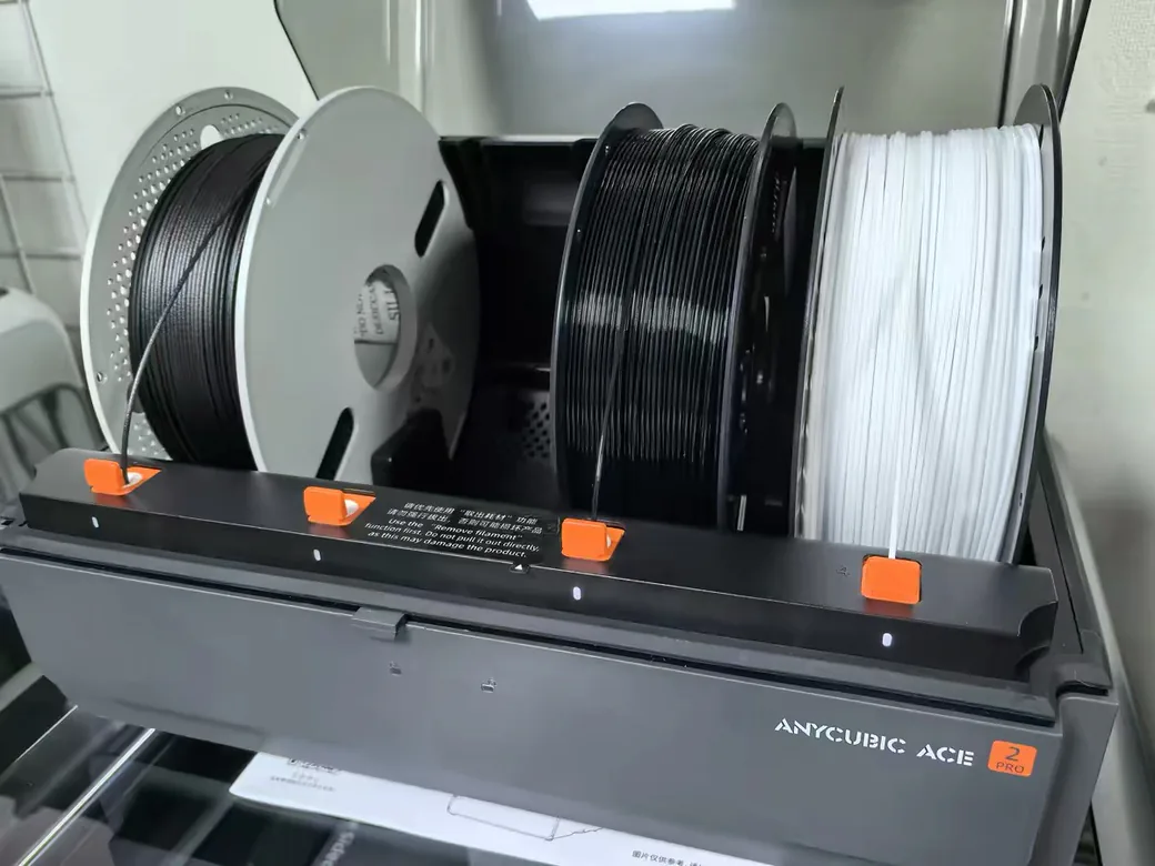 The Best Anycubic Kobra S1 Max Upgrades Worth Buying (2026) 3 Anycubic ACE 2 Pro filament system loaded with four spools of black and white filament
