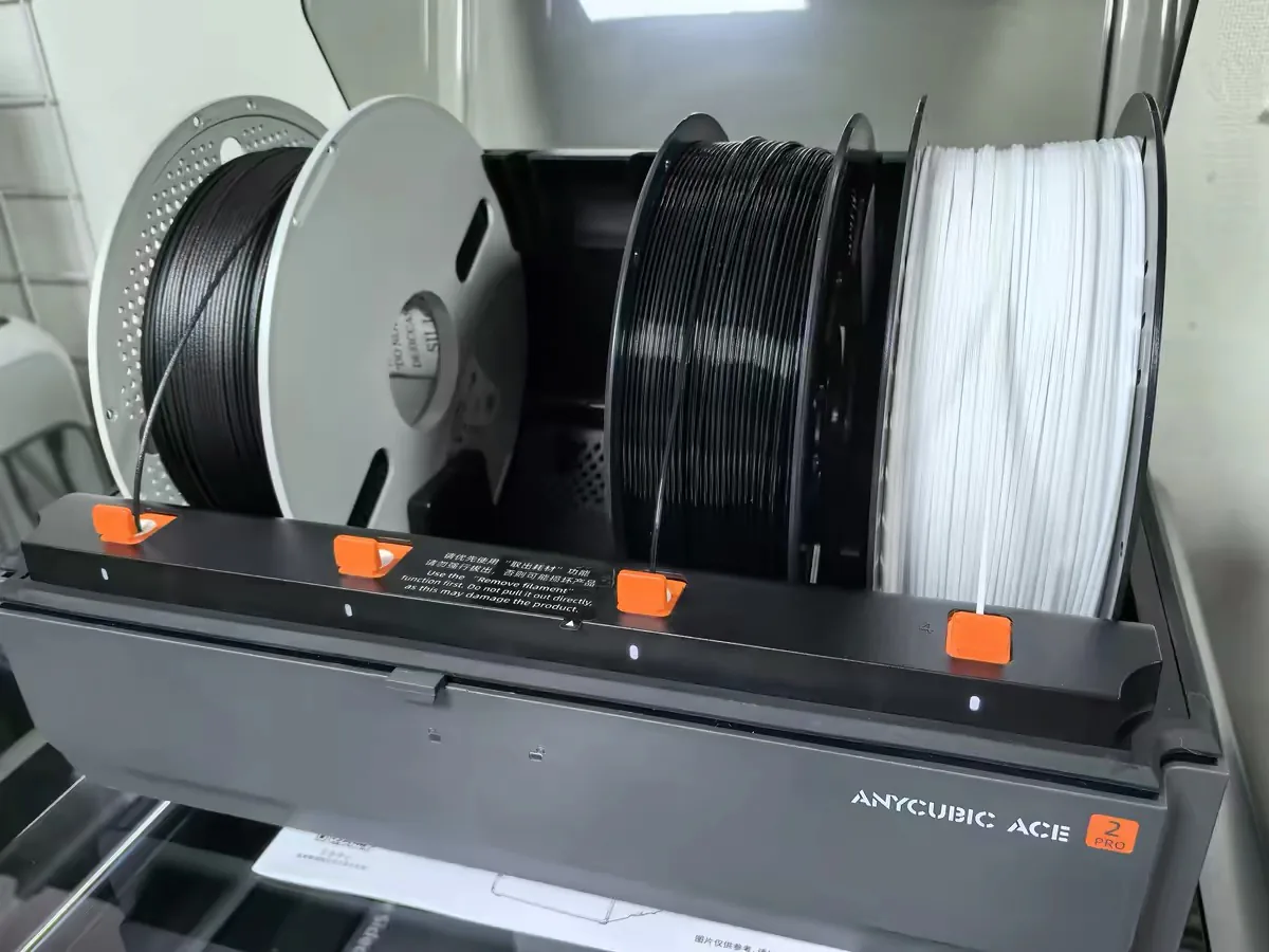 Anycubic Kobra S1 Max vs Creality K2 Plus: Same Promises, Different Failure Modes 9 The Anycubic ACE multi-material unit loaded with four filament spools