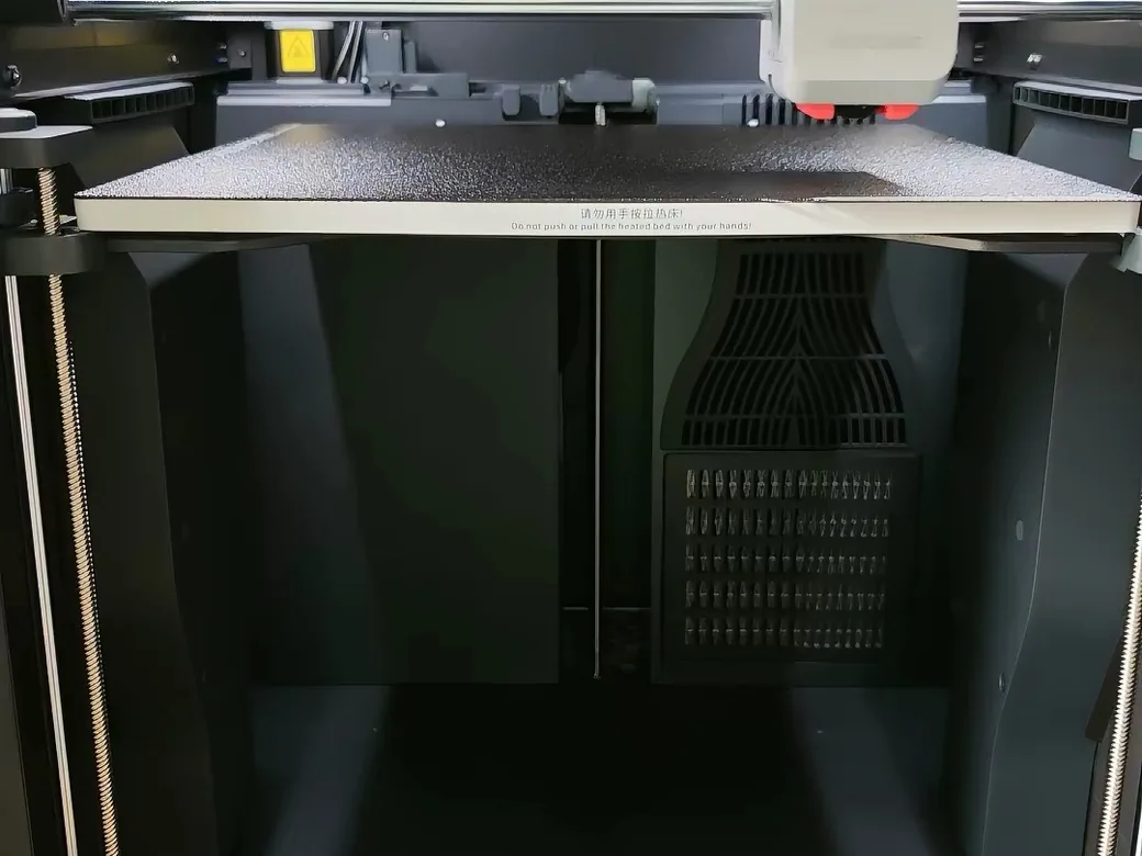 The Best Anycubic Kobra S1 Max Upgrades Worth Buying (2026) 9 Inside the Anycubic Kobra S1 Max print chamber, showing the stock carbon filter grille at the rear