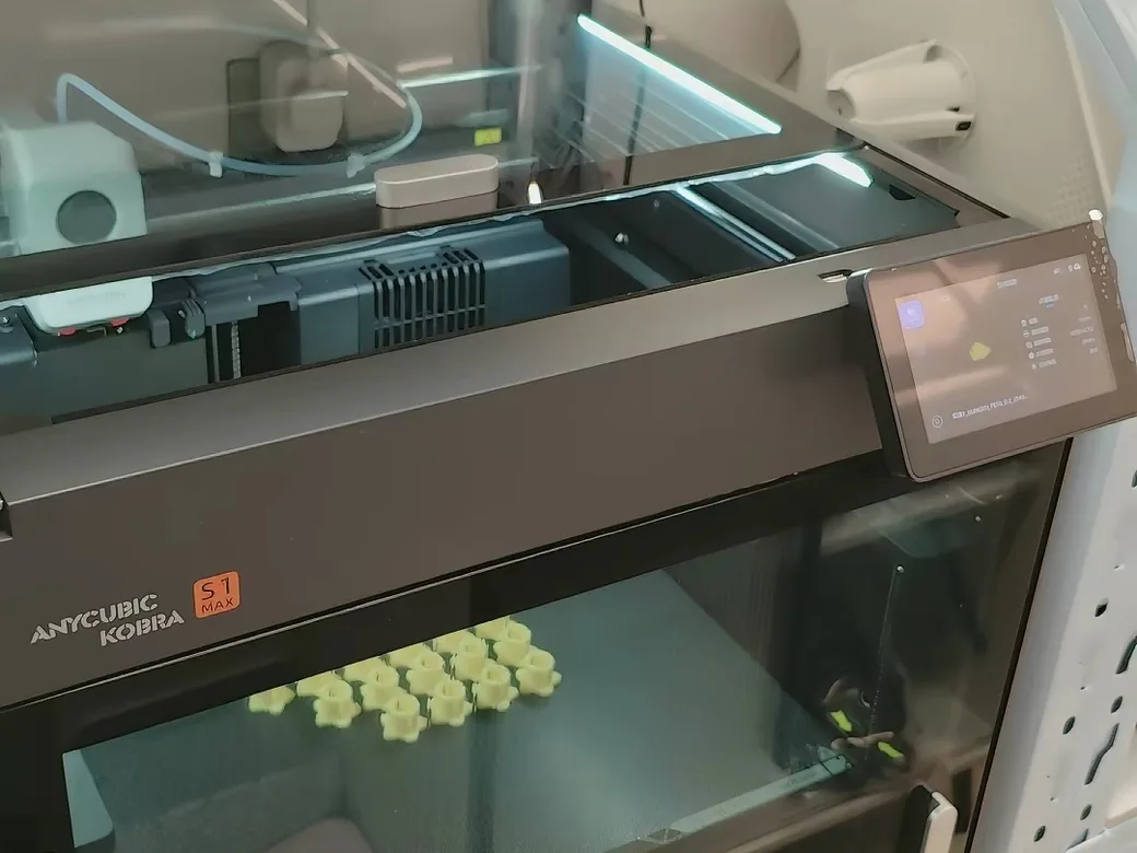 The Best Anycubic Kobra S1 Max Upgrades Worth Buying (2026) 2 Anycubic Kobra S1 Max nameplate badge on the printer's front door, confirming the S1 Max model