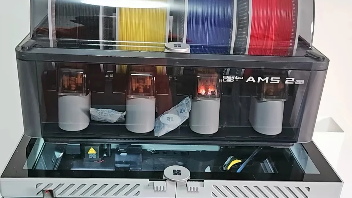 Bambu Lab Stratasys Patent Verdict 2026: Jury Orders $27.6M in Damages 2 Bambu Lab AMS 2 Pro filament system loaded with four color spools, the multi-material hardware behind the Stratasys purge tower patent dispute