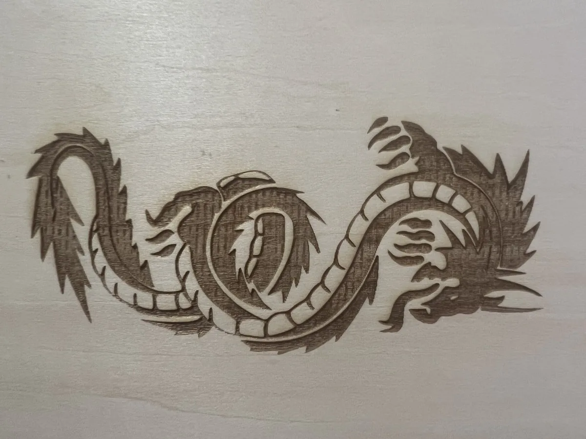 Carverall X1Pro (JL9) Review: Unboxing and Cutting Tests (2026) 22 Detailed dragon design engraved on basswood with the Carverall X1Pro