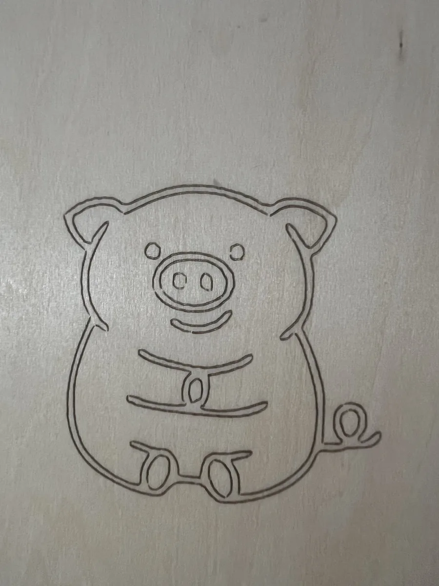 Carverall X1Pro (JL9) Review: Unboxing and Cutting Tests (2026) 23 Cute pig line-art design engraved on basswood with the Carverall X1Pro