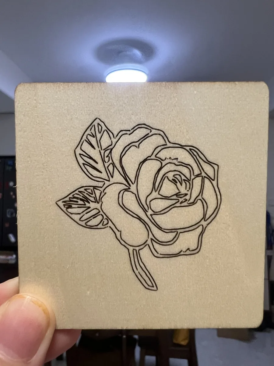 Carverall X1Pro (JL9) Review: Unboxing and Cutting Tests (2026) 24 Rose line art engraved on a basswood tile with the Carverall X1Pro