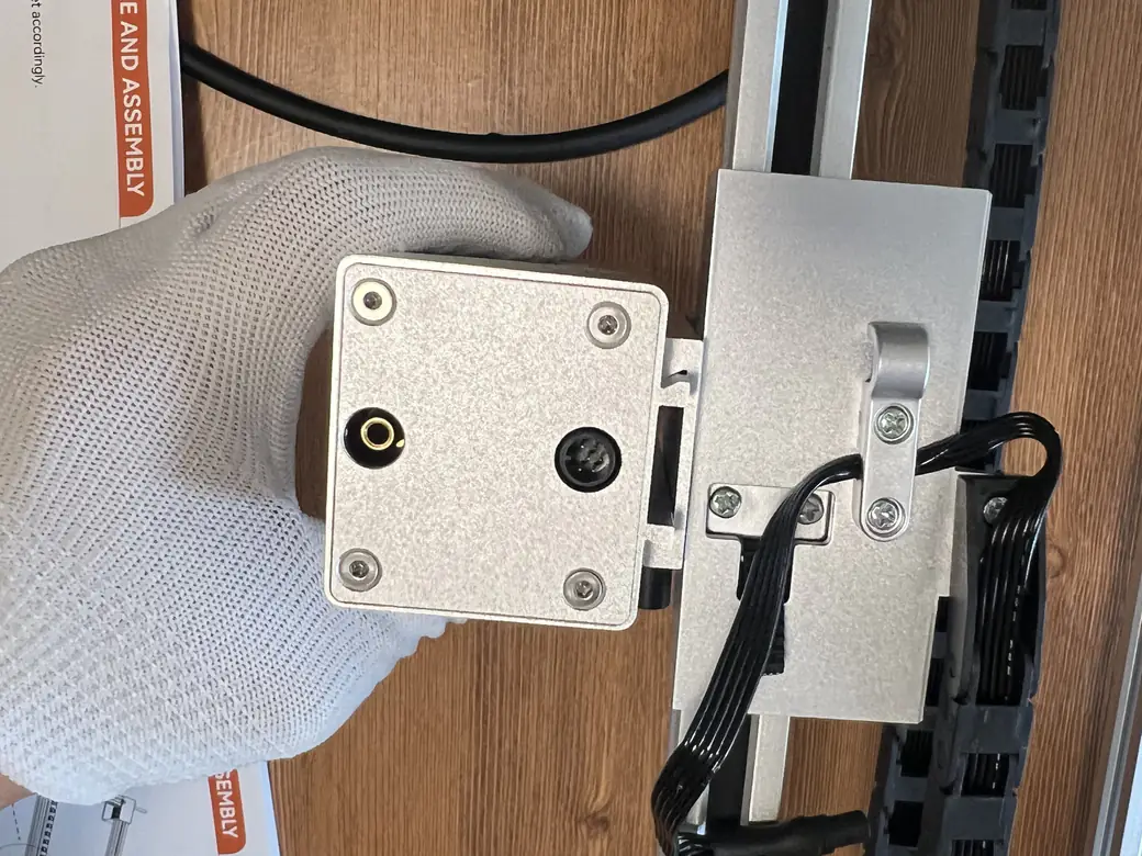 Carverall X1Pro Unboxing: Specs, Price, and What's in the Box (2026) 13 Connecting the Carverall X1Pro laser head module cable near the drag chain during assembly