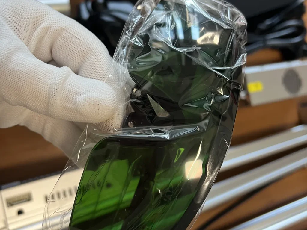 Carverall X1Pro Unboxing: Specs, Price, and What's in the Box (2026) 14 Carverall JL9 safety glasses, tinted green and still sealed in plastic