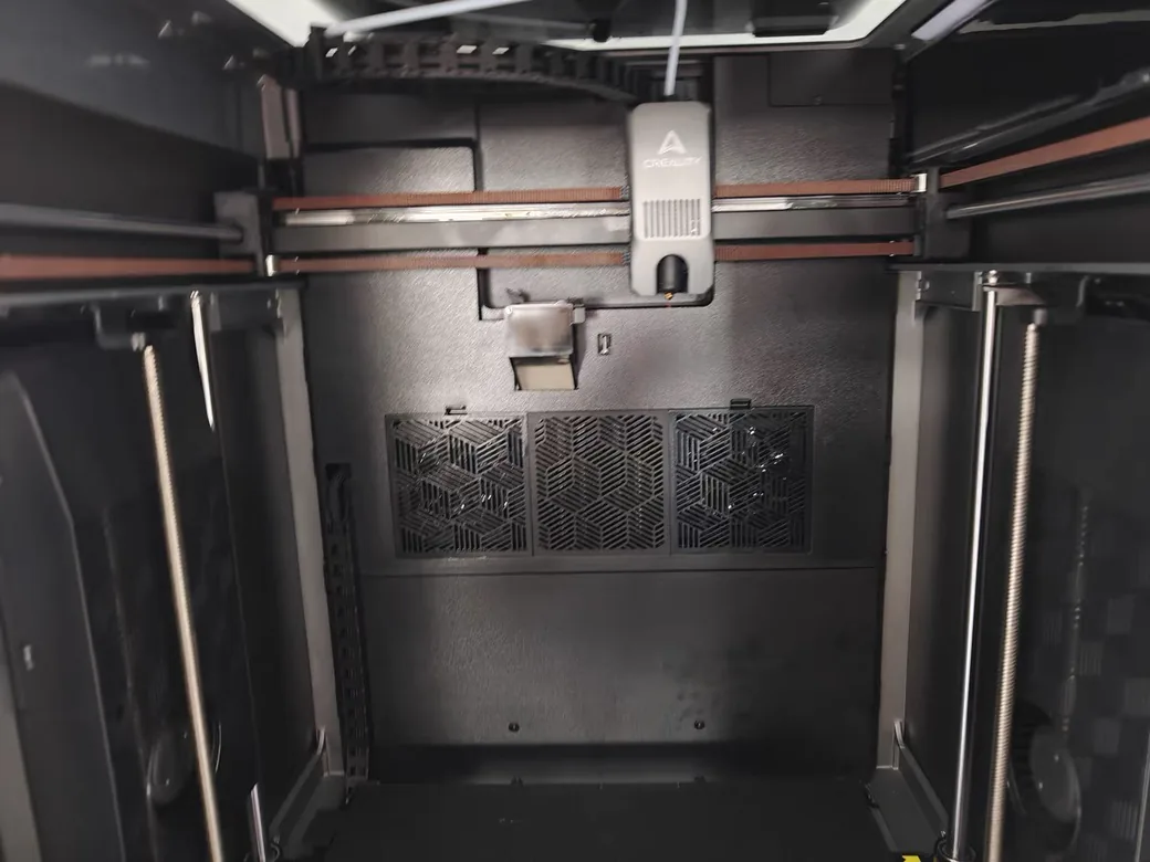 Creality K2 Plus vs Bambu Lab P2S (2026): Bigger Heated Box or the Printer That Just Works? 5 Inside the Creality K2 Plus build chamber: toolhead on the gantry, belts and the rear vent grille