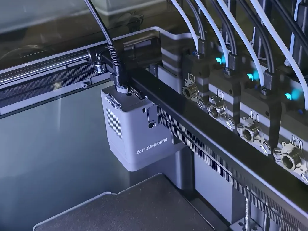 Flashforge Creator 5 vs Bambu Lab P2S: Which Fits Your Prints? 4 Flashforge Creator 5 toolhead beside docked tool modules and filament tubes